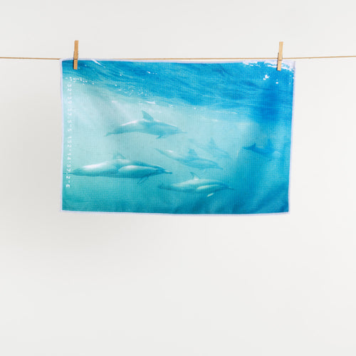 Dolphin Play tea towel