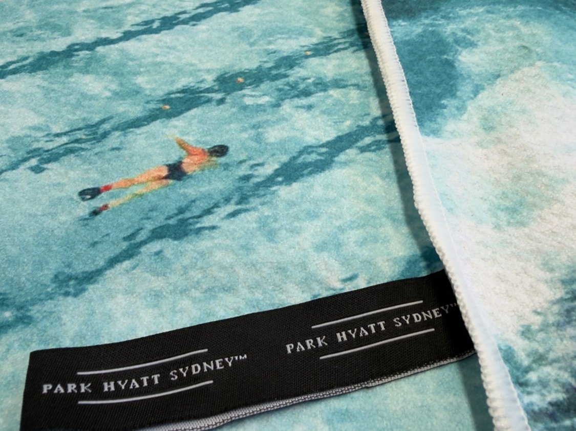 Park Hyatt Sydney branded woven label on Destination Label beach towel
