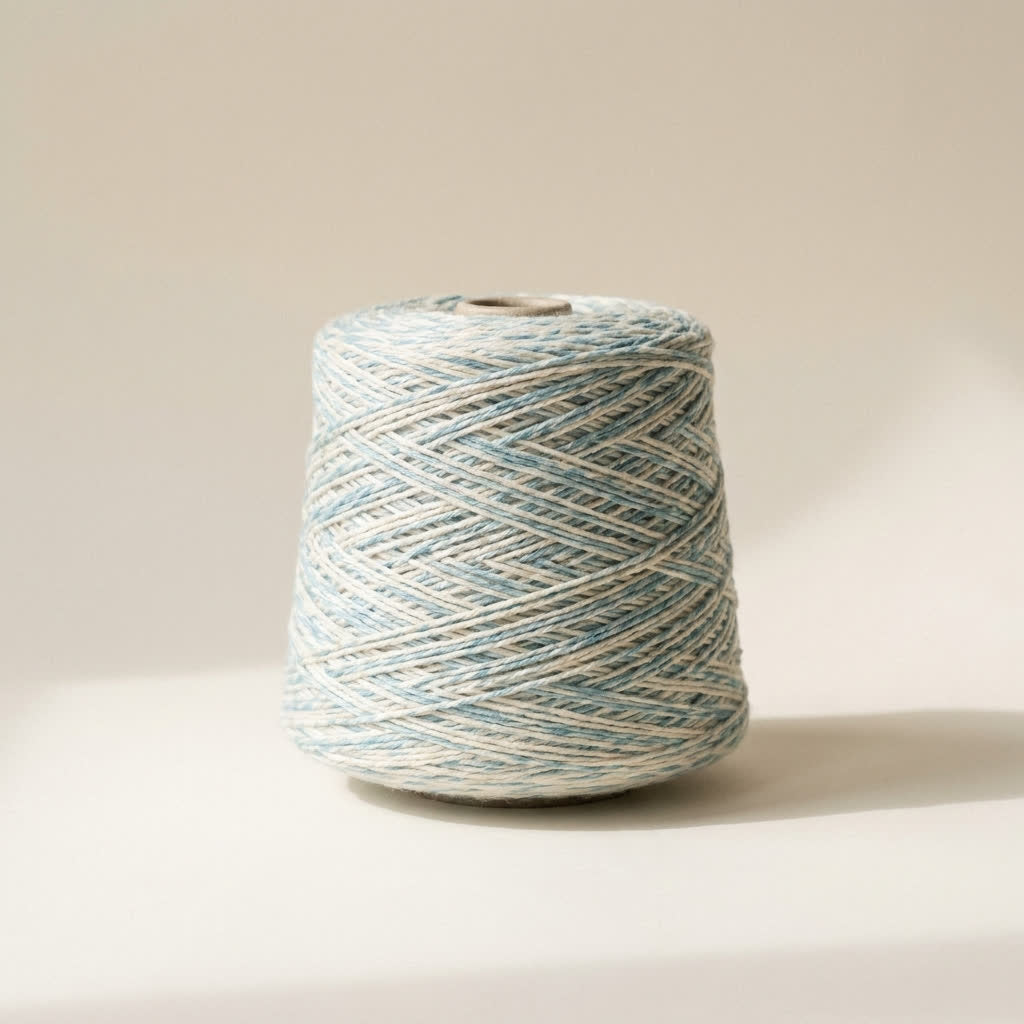 A cone of soft spun recycled yarn